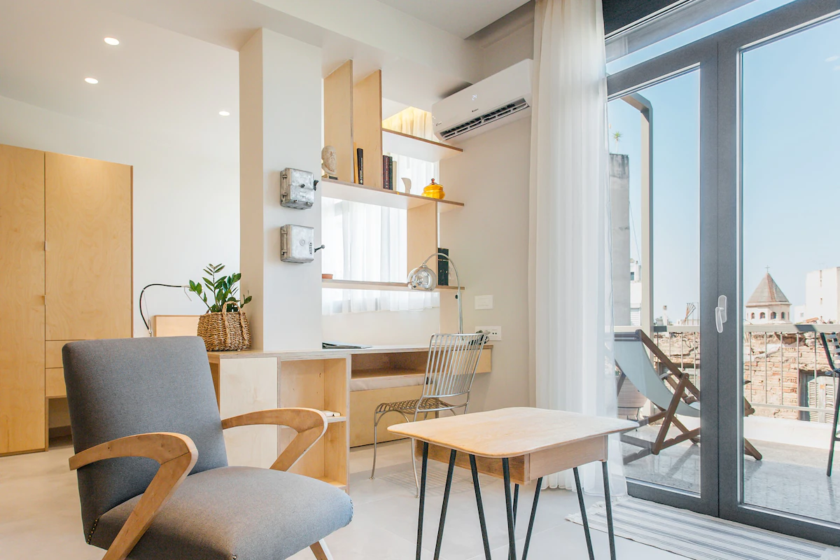 Desk and workspace beside the balcony at an Estiano residence